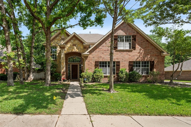 1417 Flying Jib Dr, Azle, TX 76020 - traditional-style house with a front yard, brick siding, and stone siding
