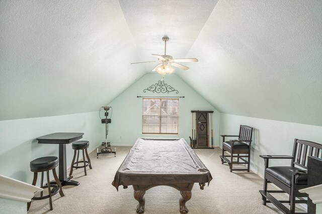 bar with lofted ceiling, light stone counters, light carpet, dark brown cabinets, and beverage cooler