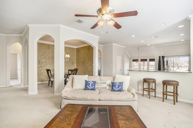 living room featuring ornamental molding and light colored carpet