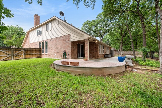 1417 Flying Jib Dr, Azle, TX 76020 - back of property featuring a chimney, brick siding, a deck, and a gate