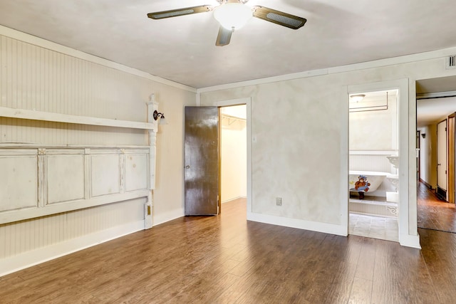 unfurnished bedroom featuring ceiling fan and dark hardwood / wood-style floors