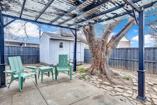 view of patio with a storage shed and a pergola