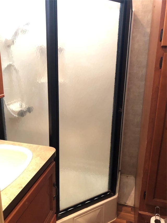 bathroom featuring hardwood / wood-style flooring and vanity