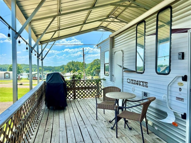 wooden deck with area for grilling