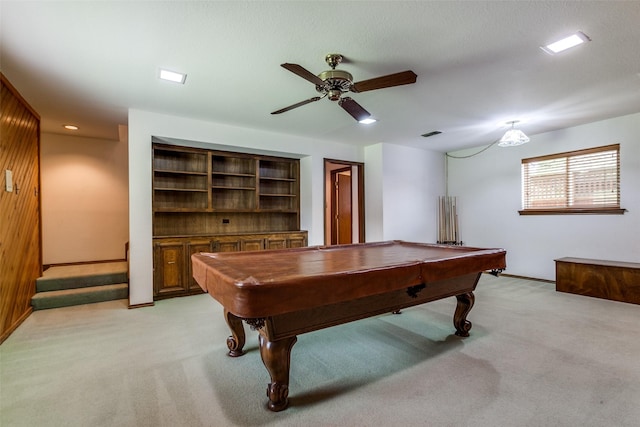 rec room with pool table, light carpet, wooden walls, built in features, and ceiling fan