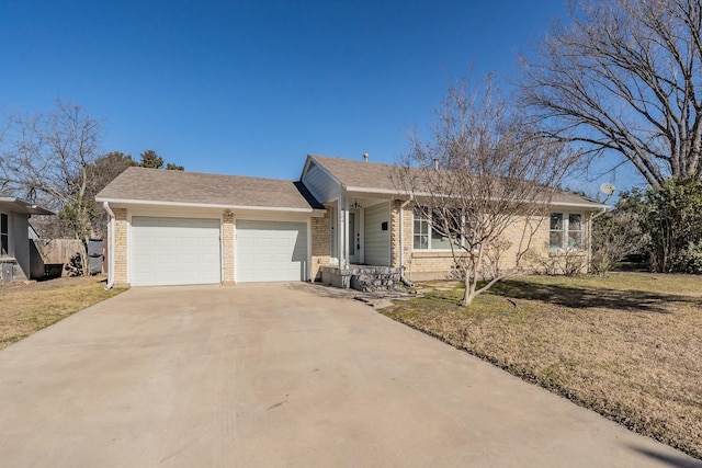 ranch-style home featuring a garage and a front yard