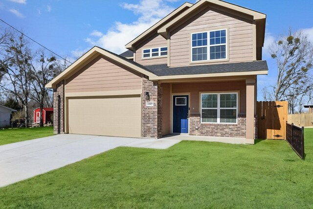 craftsman-style house with a garage and a front lawn