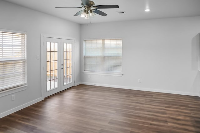 unfurnished room featuring dark hardwood / wood-style floors, french doors, and ceiling fan