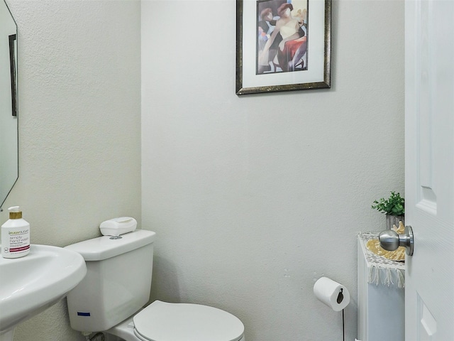 bathroom with sink and toilet