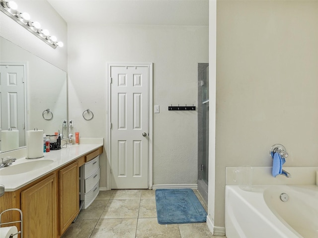 bathroom featuring vanity, tile patterned floors, and shower with separate bathtub