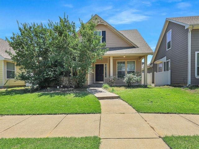 view of front of home featuring a porch and a front yard