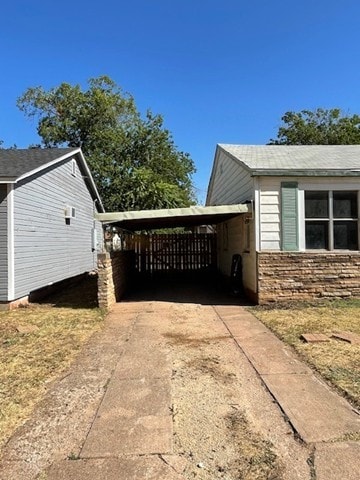 view of property exterior featuring a carport