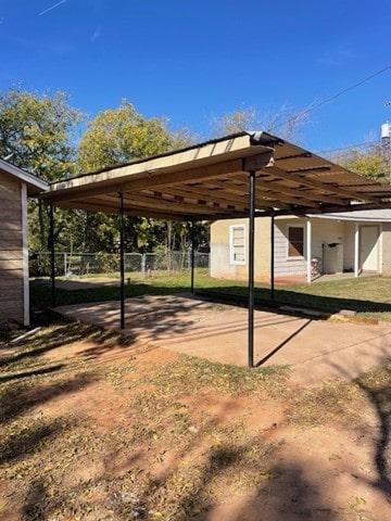 view of vehicle parking featuring a carport