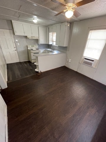 kitchen with ceiling fan, white range with electric cooktop, a textured ceiling, white cabinets, and dark hardwood / wood-style flooring