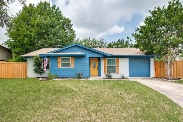 ranch-style home with a garage and a front lawn