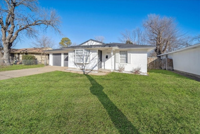 view of front of house featuring a garage, driveway, a front lawn, and fence