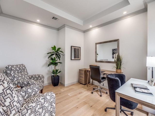 home office featuring ornamental molding and light wood-type flooring