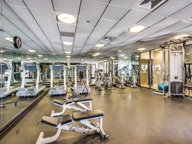 workout area featuring a drop ceiling