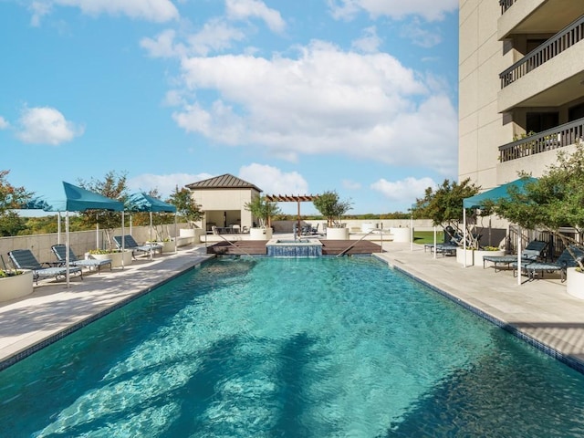 view of swimming pool with a patio