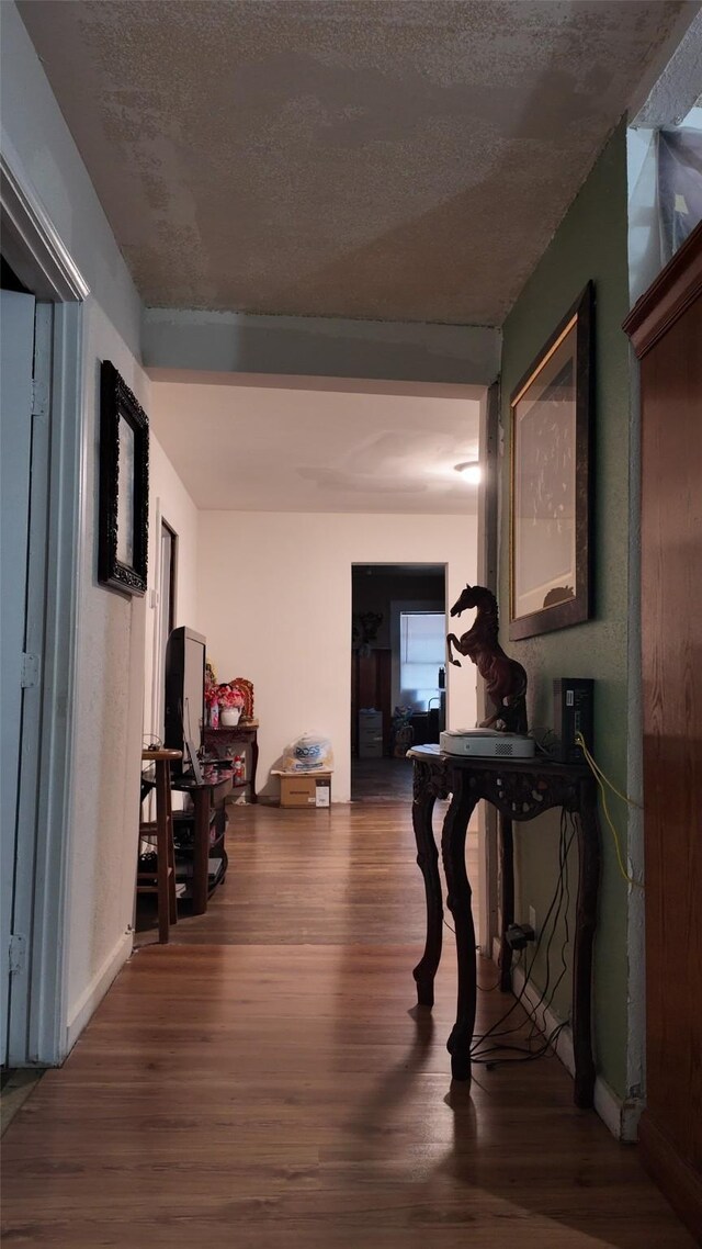 corridor featuring hardwood / wood-style floors