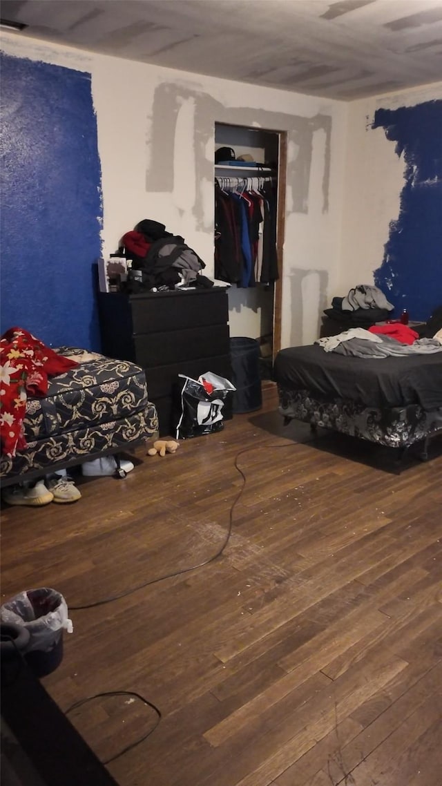 bedroom featuring hardwood / wood-style flooring and a closet