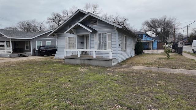 bungalow-style house featuring a front lawn and a porch