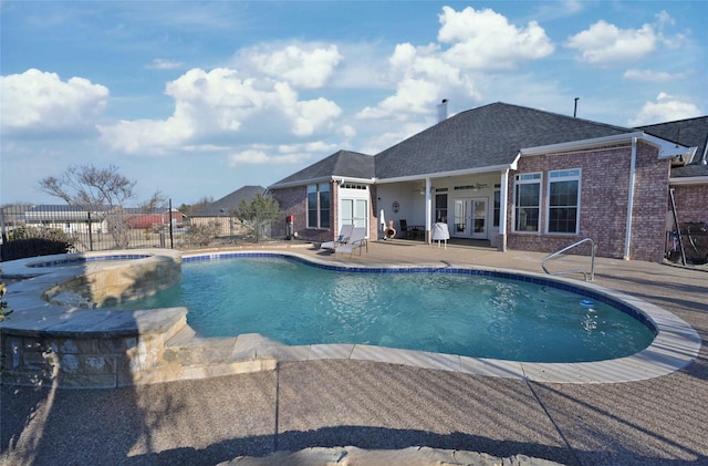 view of swimming pool with an in ground hot tub, ceiling fan, and a patio area