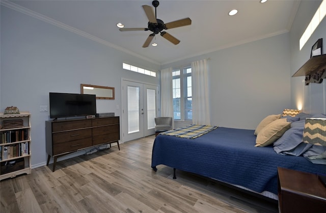 bedroom with french doors, ceiling fan, ornamental molding, and light wood-type flooring