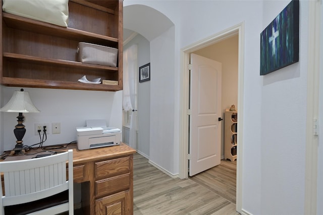 office area with light hardwood / wood-style floors