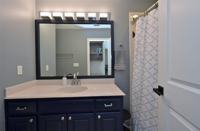 bathroom with vanity and curtained shower