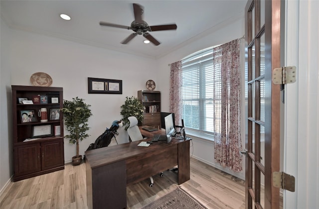 office with crown molding, plenty of natural light, and light hardwood / wood-style floors