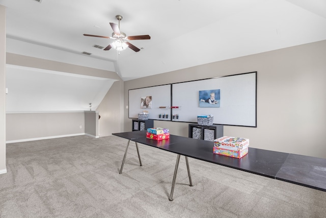 office space with lofted ceiling, ceiling fan, and carpet