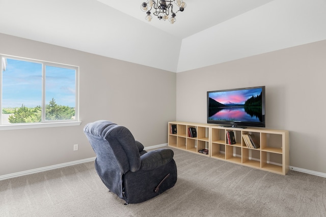 living area featuring lofted ceiling, carpet floors, and a notable chandelier