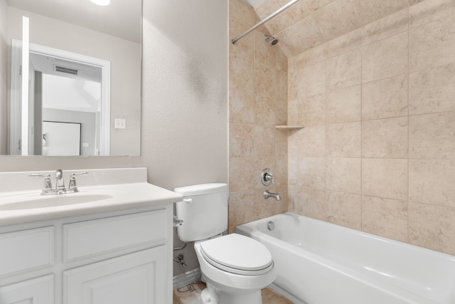 full bathroom with tiled shower / bath combo, vanity, and toilet