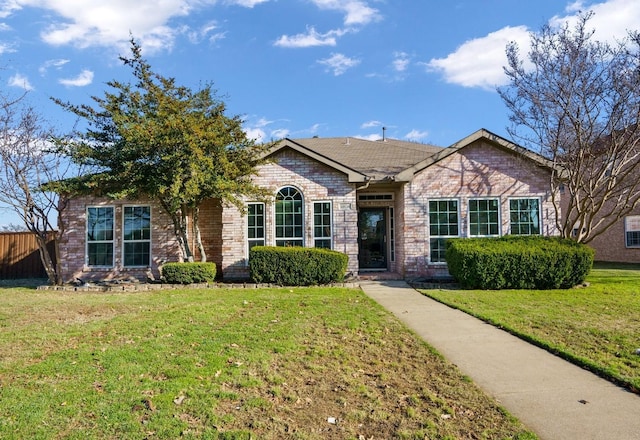 ranch-style house featuring a front lawn