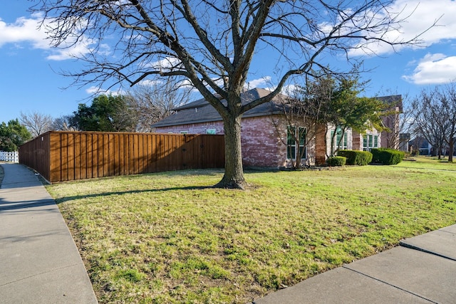 view of property exterior with a lawn