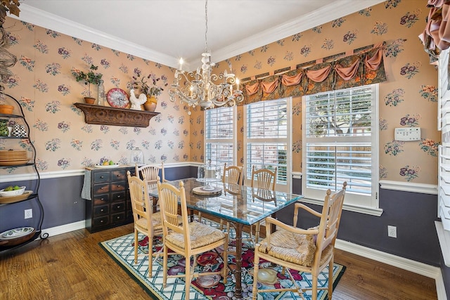 dining room featuring ornamental molding, dark hardwood / wood-style floors, and a notable chandelier