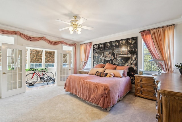 bedroom featuring multiple windows, crown molding, light colored carpet, and ceiling fan