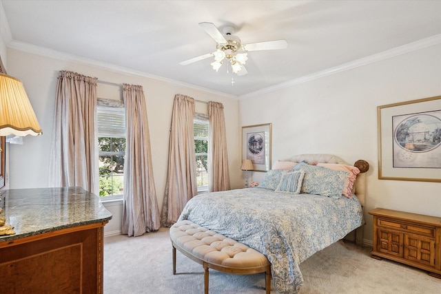 bedroom with multiple windows, ceiling fan, crown molding, and light carpet