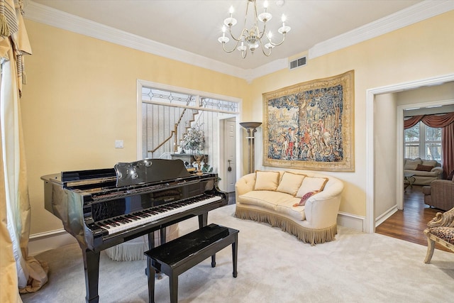 miscellaneous room with crown molding, carpet floors, and a notable chandelier