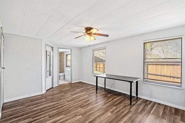 spare room featuring ceiling fan and dark hardwood / wood-style floors