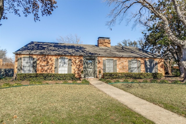 ranch-style home with a front lawn