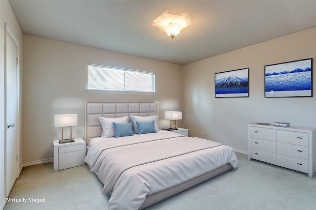 bedroom featuring light carpet