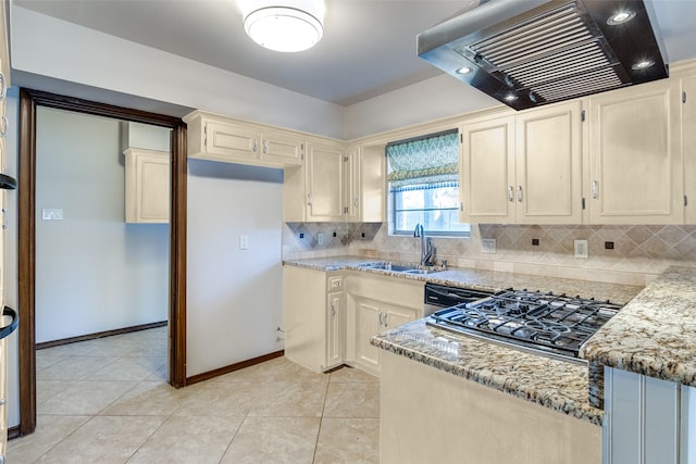 kitchen featuring light stone countertops, sink, light tile patterned floors, and range hood