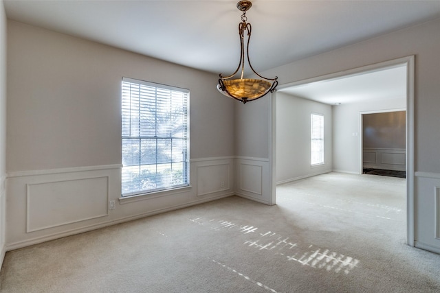 empty room with light colored carpet