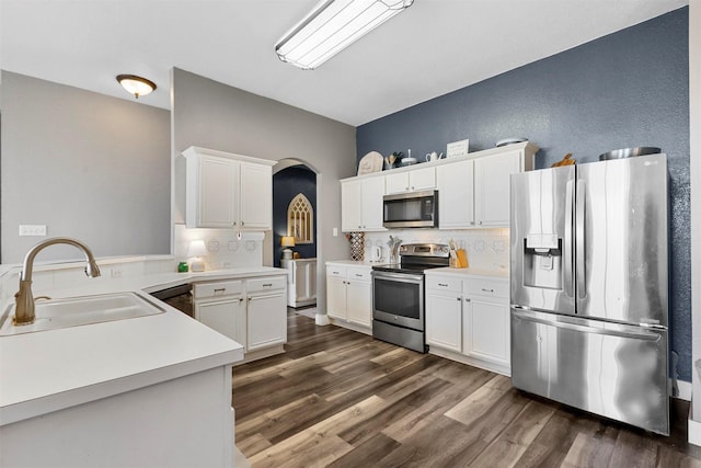 kitchen featuring sink, stainless steel appliances, and white cabinets