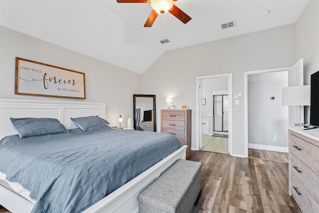 bedroom featuring dark wood-type flooring, ceiling fan, and vaulted ceiling