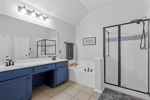 bathroom featuring tile patterned floors, separate shower and tub, vaulted ceiling, a textured ceiling, and vanity