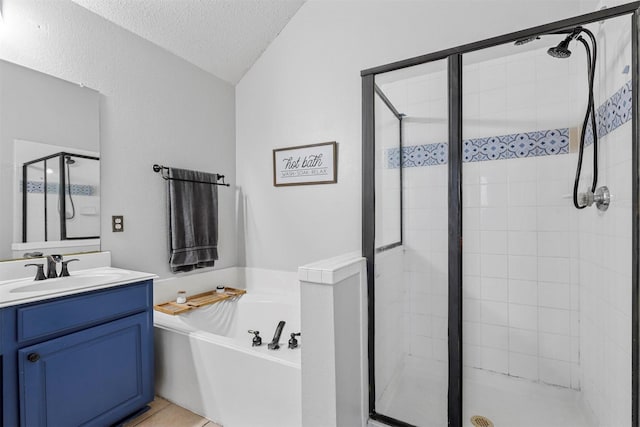 bathroom featuring vanity, shower with separate bathtub, tile patterned flooring, and a textured ceiling