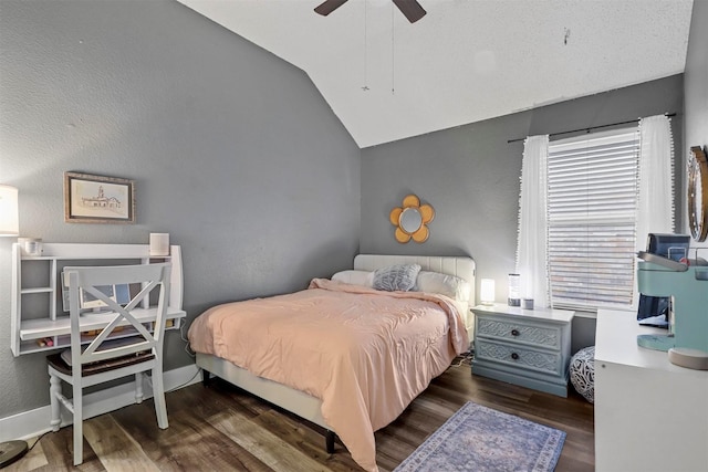 bedroom featuring vaulted ceiling, dark wood-type flooring, and ceiling fan